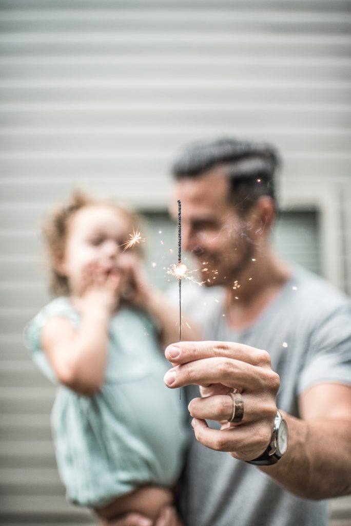 Photo of smiling father and daughter