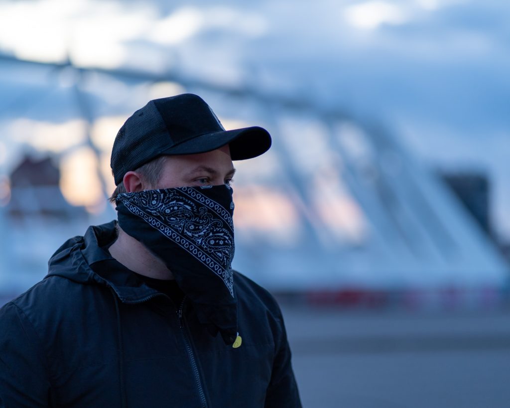Photo of man wearing a bandana mask