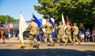 Veterans holding flags in a parade